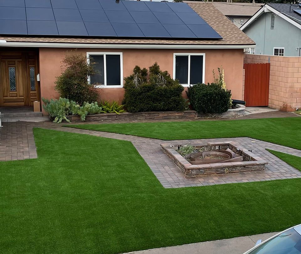 A house with artificial turf and pavers in Orange County